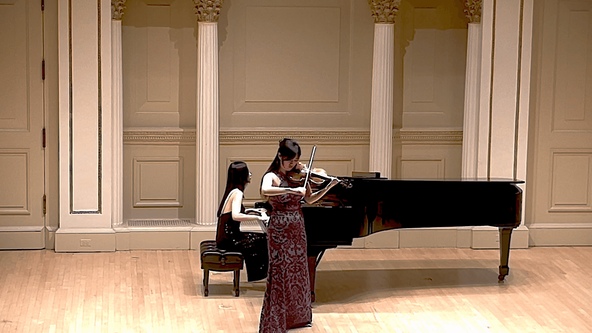 Bin Gui performing Brahms Scherzo with piano on stage