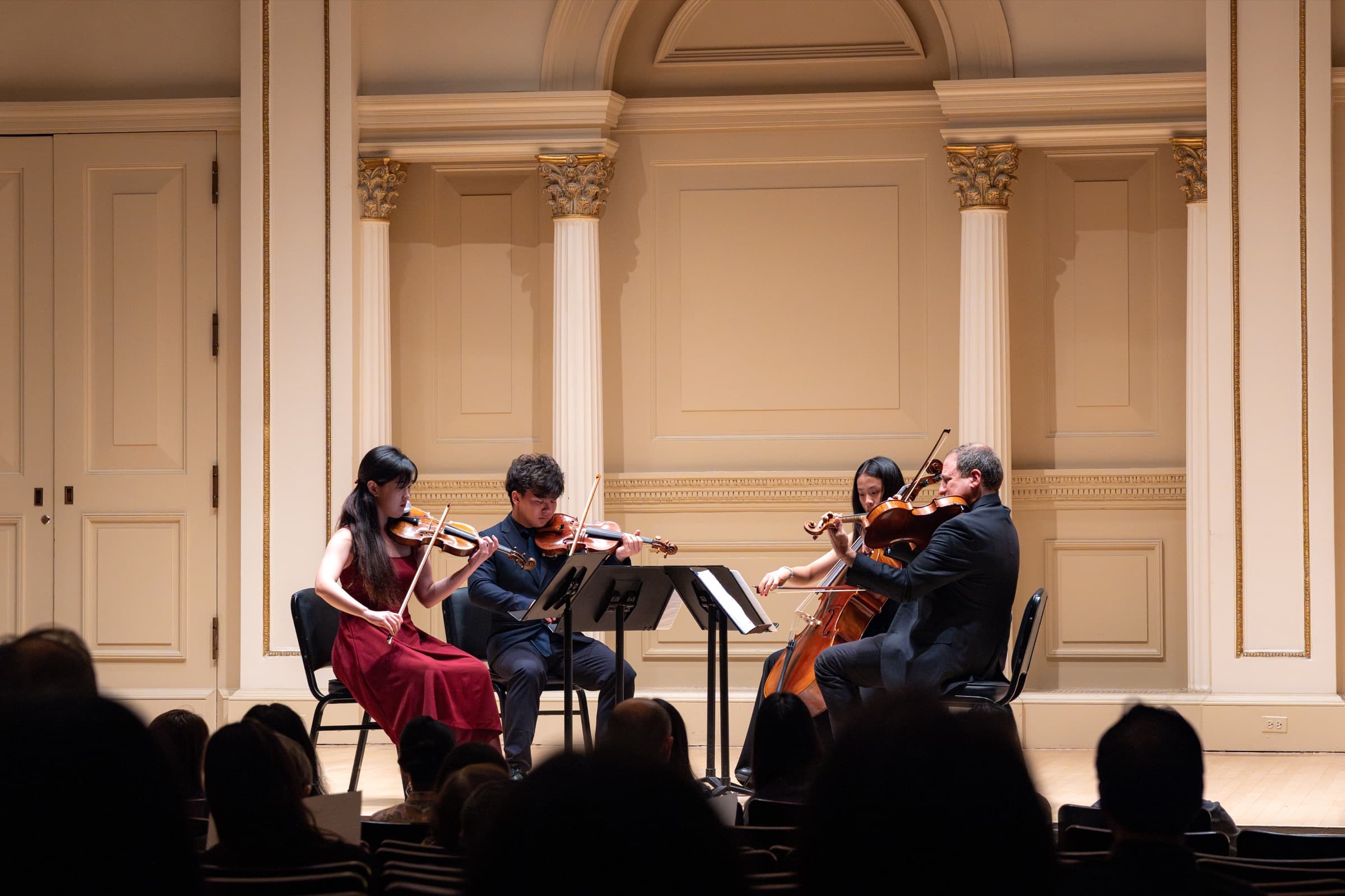 Bin Gui performing chamber music with a string quartet